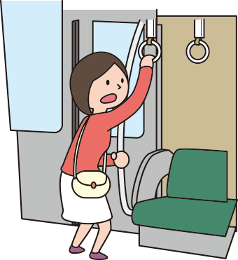 つり革につかまる女性